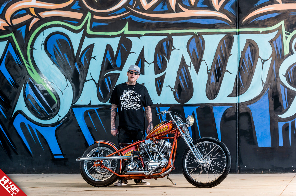 Motorcycle artist with orange motorcycle
