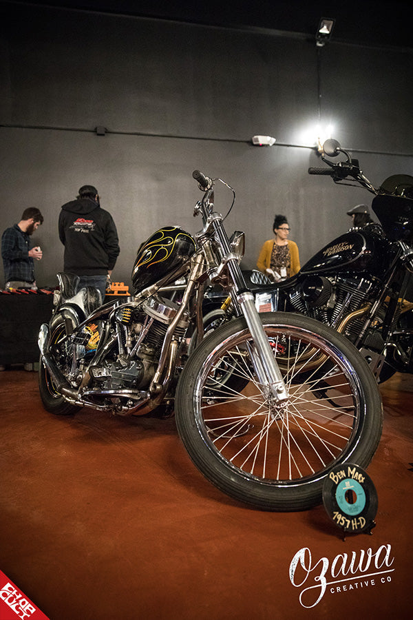 A photo of a black bike with yellow flames