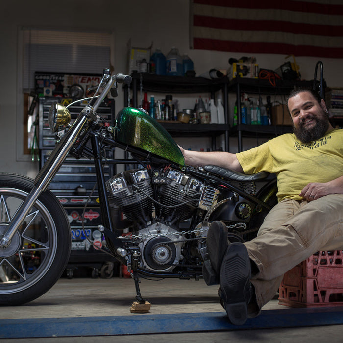 A photo of Lemmy with his green shovelhead discussed in this post. 