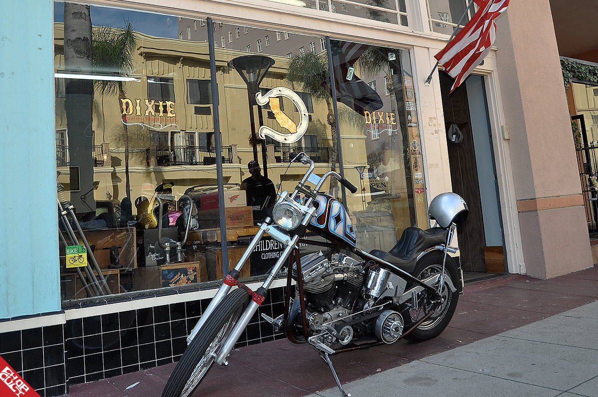 A photo of the panhead discussed in this post in front of a storefront. 
