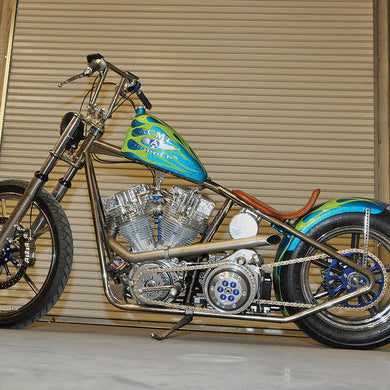 A photo of the left side of the green and aqua bike discussed in this post.