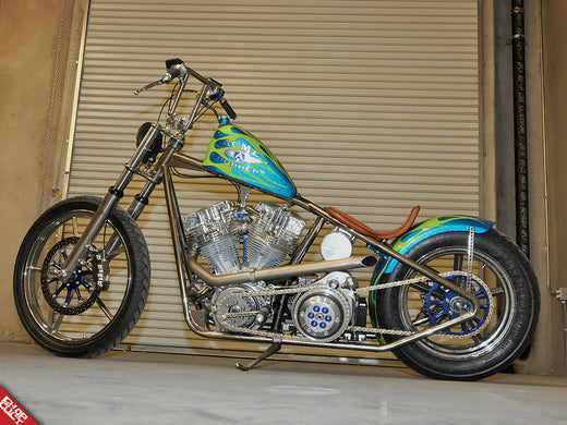 A photo of the left side of the green and aqua bike discussed in this post.