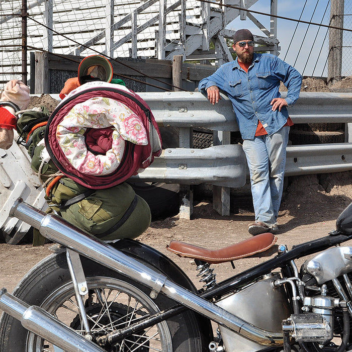 A photo of Jess and his bike