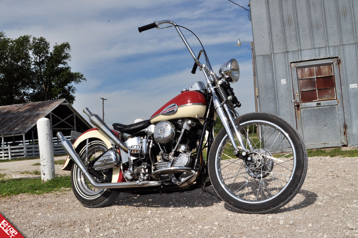 A view of the red and cream colored bike with ape hangers discussed in this post