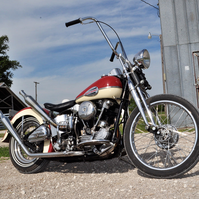 A view of the red and cream colored bike with ape hangers discussed in this post