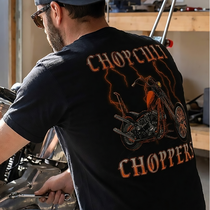 Rep Chop Cult with a stormy chopper graphic featuring orange lightning, gothic lettering, and a full-back custom motorcycle print.

Printed with a small front left chest logo and full back artwork on a black 100% cotton T-shirt.