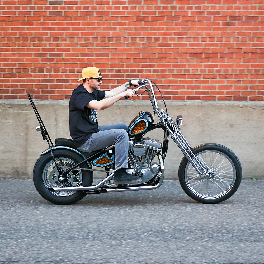 man riding a sportster chopper