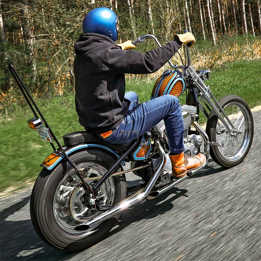 man riding a sportster chopper