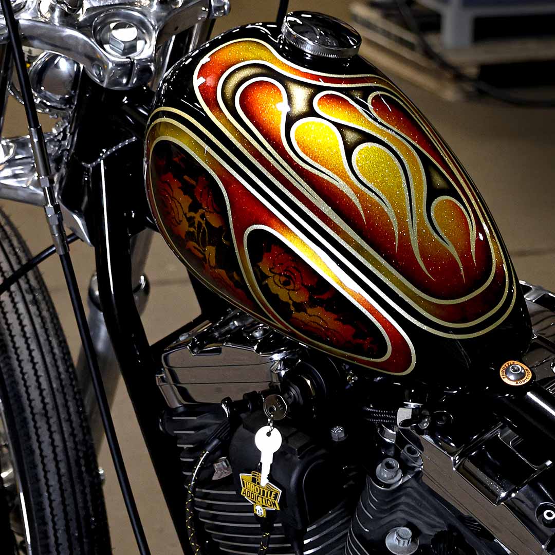 close up of a motorcycle tank with 70s style chopper paint